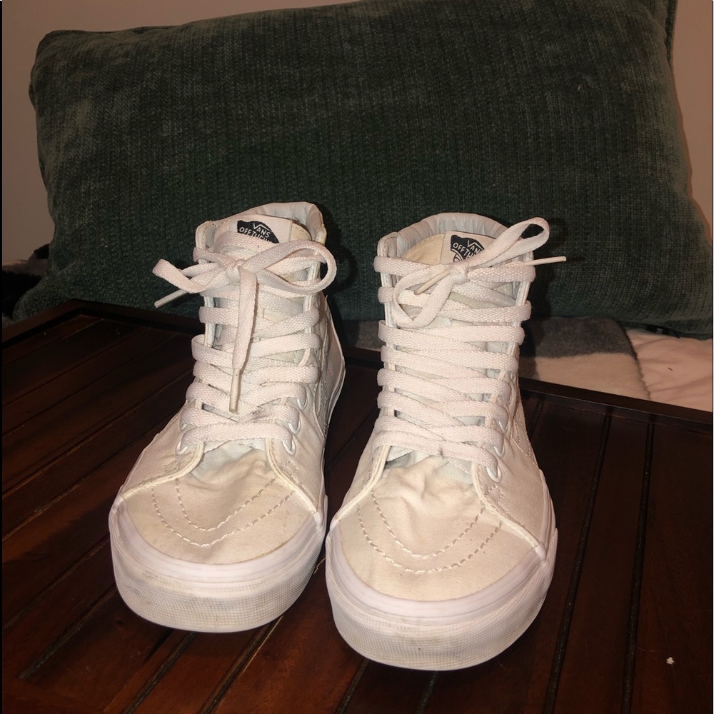 All white Vans high top